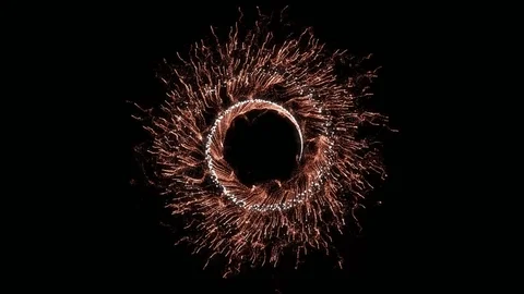 Red and gold fireworks bursting in circular pattern